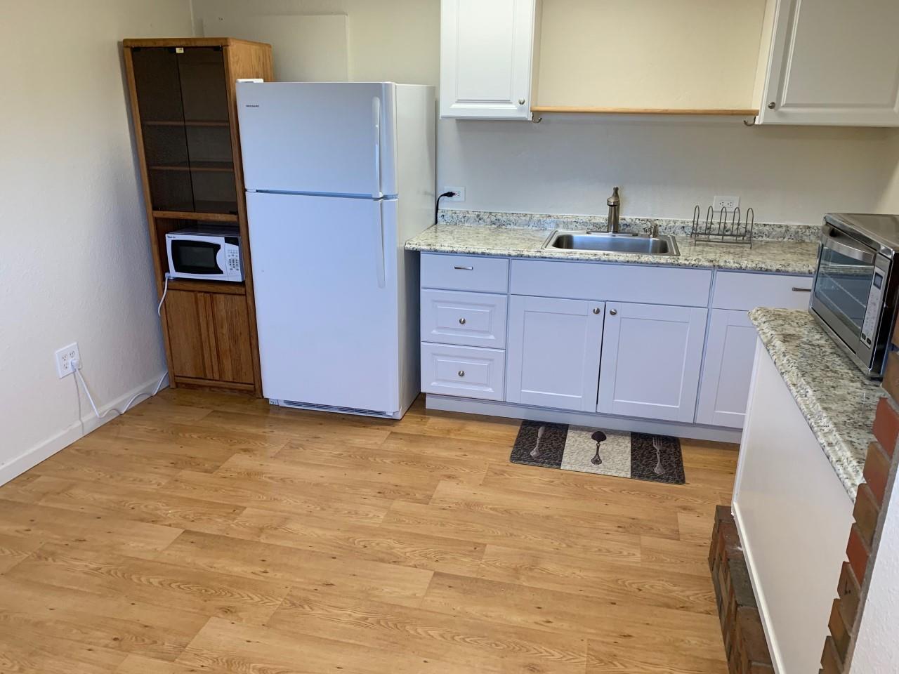 815 Edgemar Avenue Pacifica, CA 94044 - Photo 22 of 27 a kitchen with cabinets and stainless steel appliances