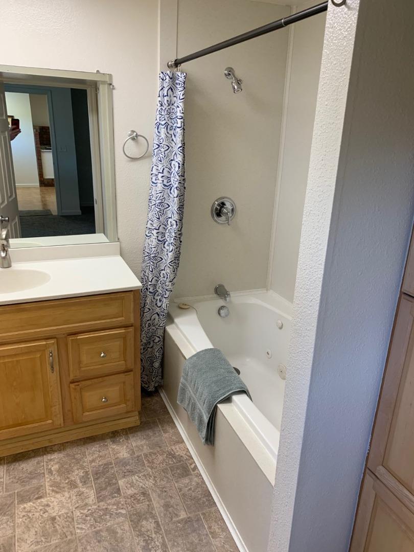 815 Edgemar Avenue Pacifica, CA 94044 - Photo 27 of 27 a bathroom with a tub sink and mirror