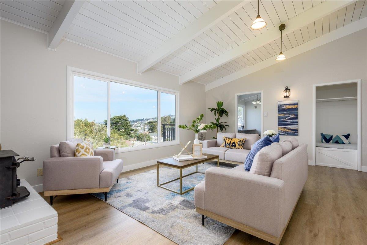 815 Edgemar Avenue Pacifica, CA 94044 - Photo 3 of 27 a living room with furniture and a large window