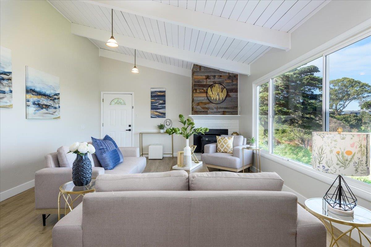 815 Edgemar Avenue Pacifica, CA 94044 - Photo 5 of 27 a living room with furniture and a large window