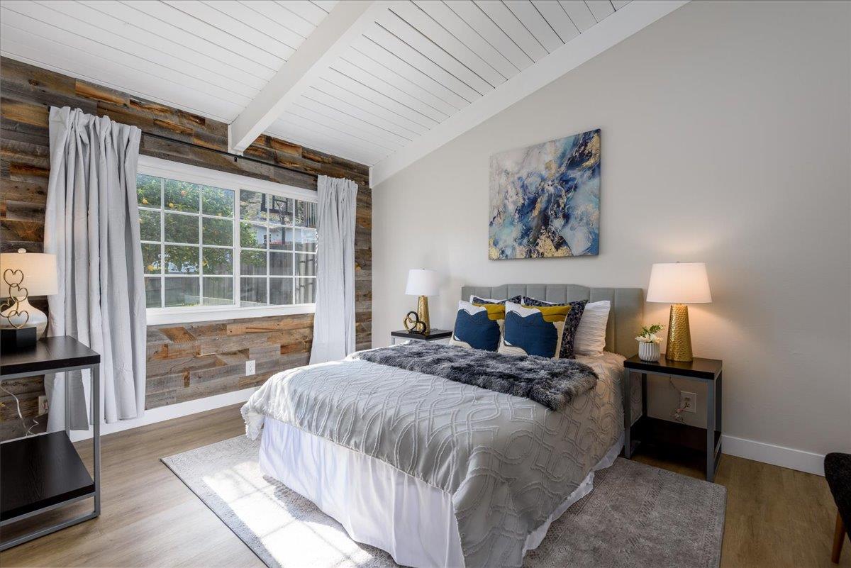 815 Edgemar Avenue Pacifica, CA 94044 - Photo 10 of 27 a bedroom with a bed and a window