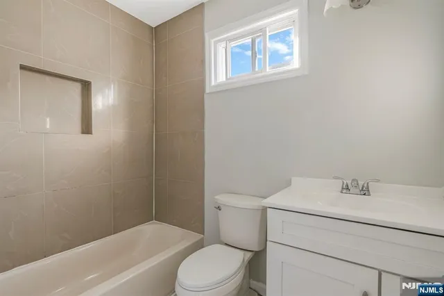 a bathroom with a sink toilet and bathtub
