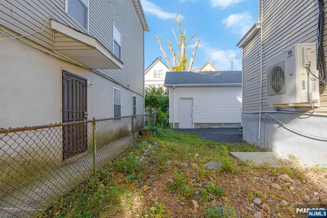 a view of a back yard of the house