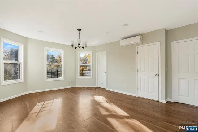 a view of livingroom with window ceiling fan and hardwood floor
