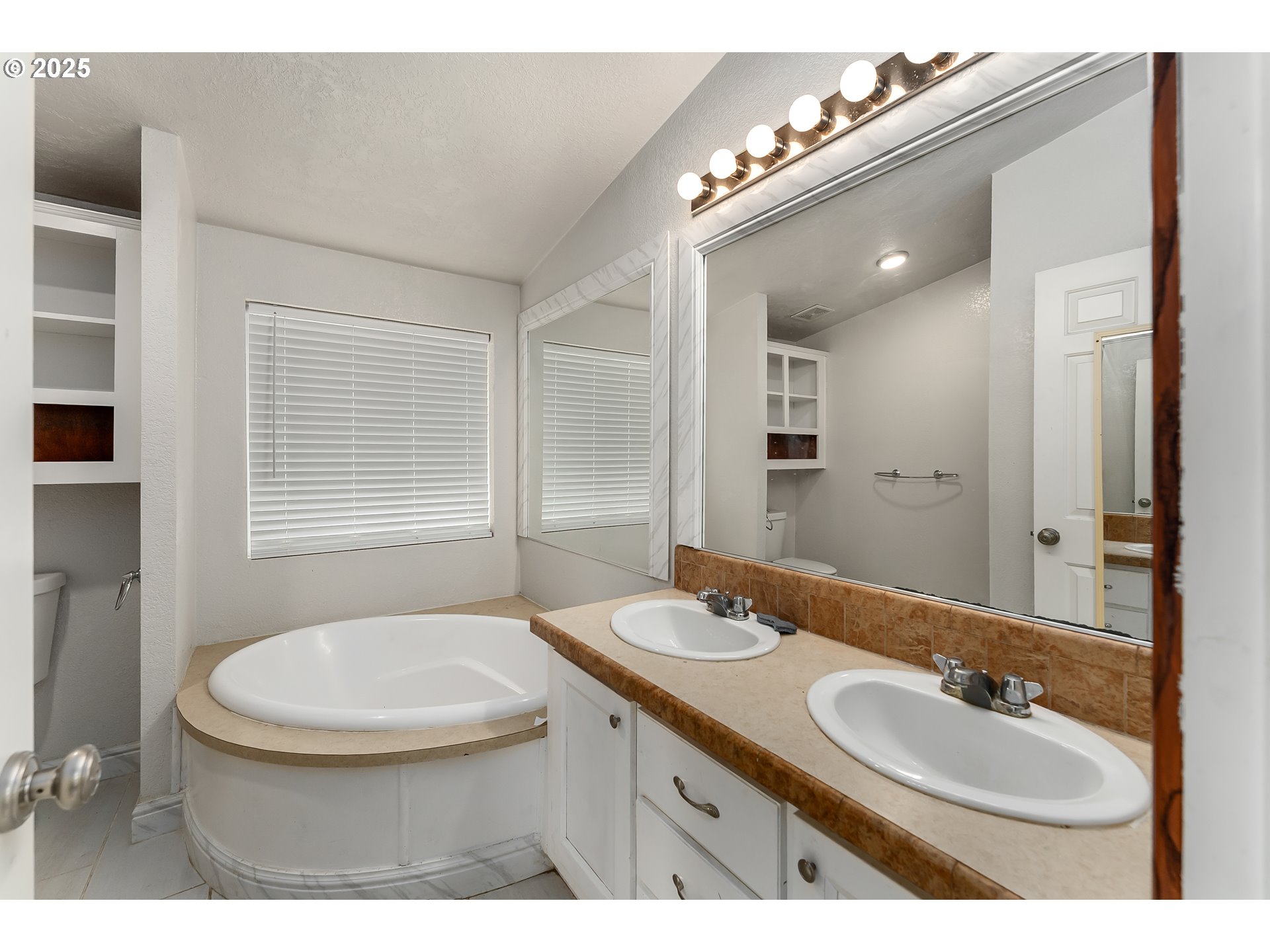 161 South Avenue Sutherlin, OR 97479 - Photo 16 of 45 a bathroom with a granite countertop sink a mirror and a toilet