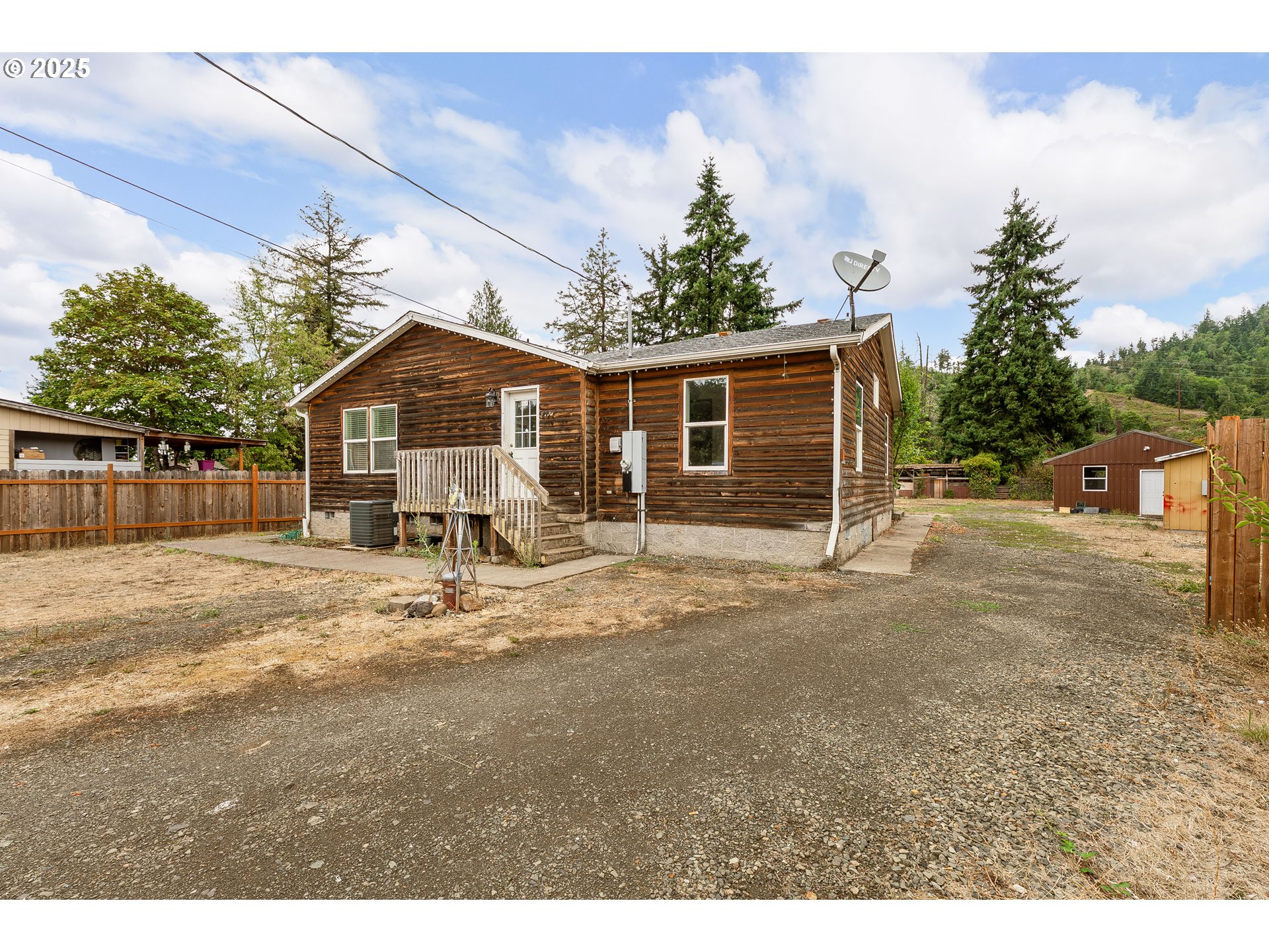 161 South Avenue Sutherlin, OR 97479 - Photo 29 of 45 a view of a house with a yard and potted plants