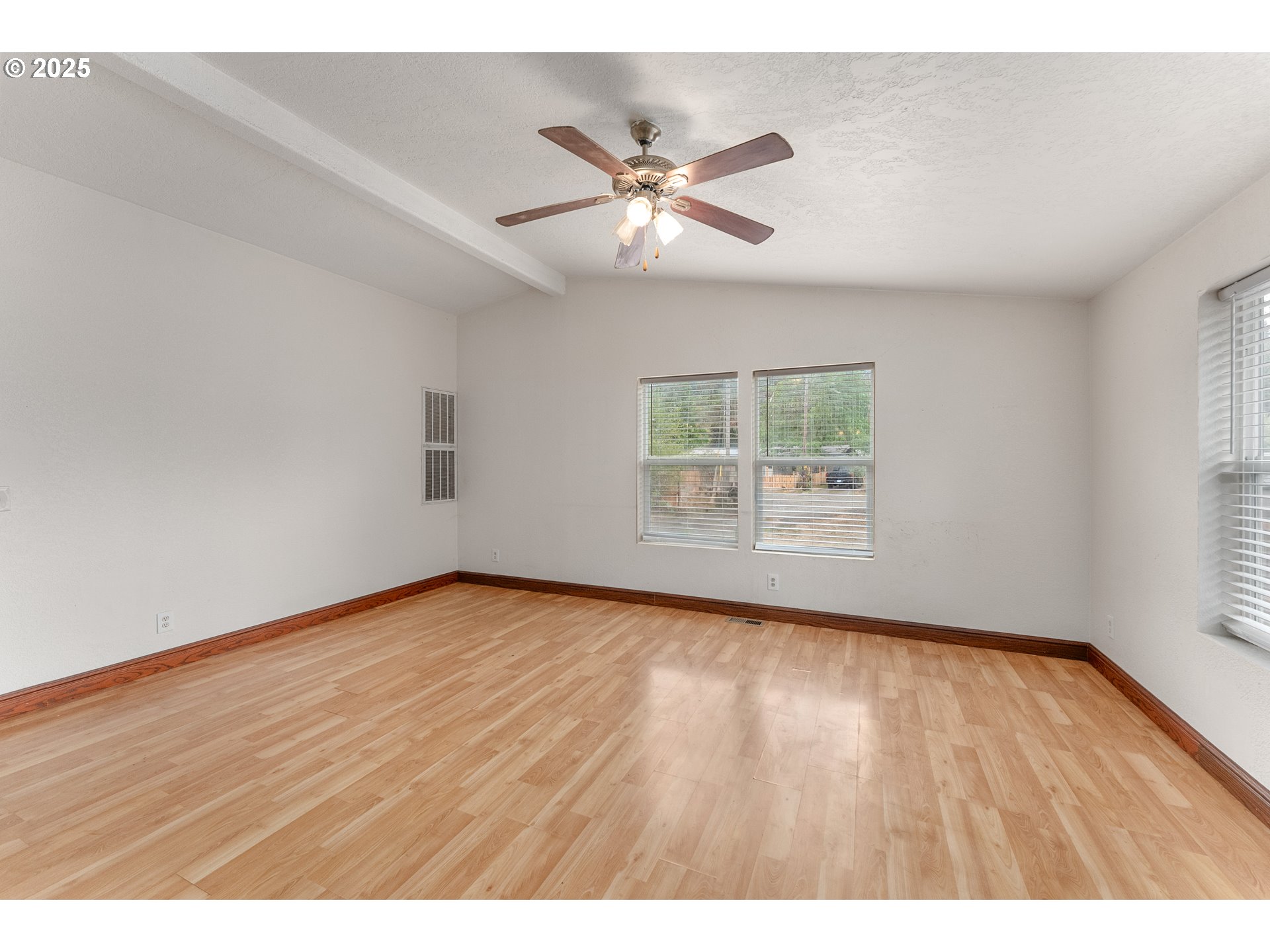 161 South Avenue Sutherlin, OR 97479 - Photo 3 of 45 a view of an empty room with wooden floor and a window
