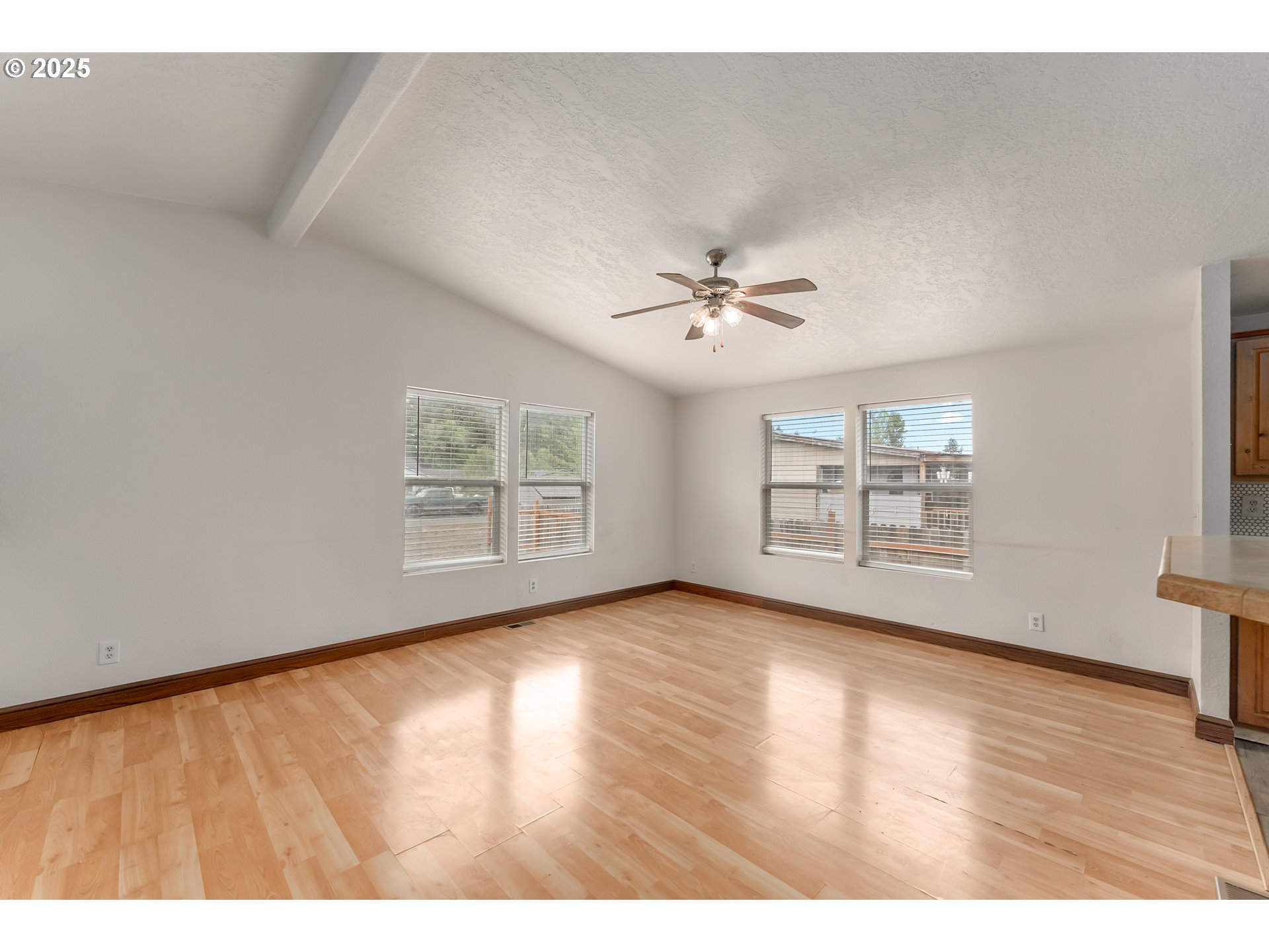 161 South Avenue Sutherlin, OR 97479 - Photo 4 of 45 a view of an empty room with wooden floor and a window