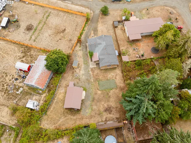 an aerial view of residential house with outdoor space