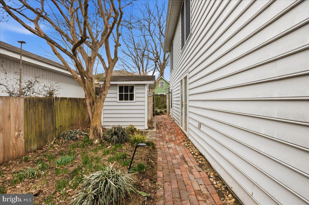 14382 Sedwick Avenue Solomons, MD 20688 - Photo 65 of 90 Storage shed, walkway on side of the building