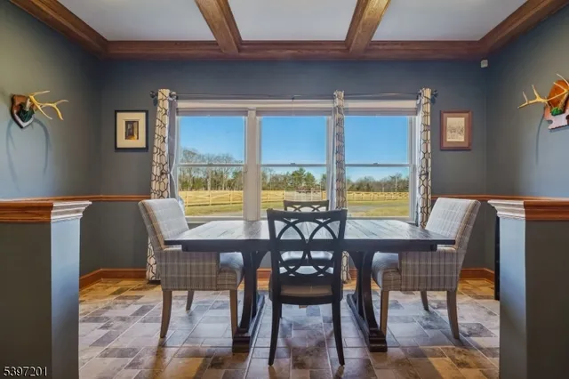 a spacious bedroom with a bed and wooden floors