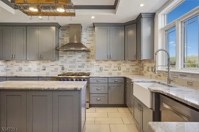 a kitchen that has a stove and a wooden cabinets