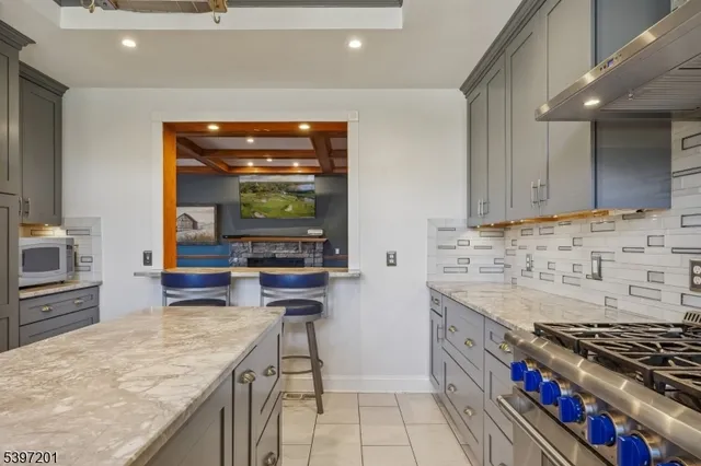 a view of a dining room with furniture wooden floor and chandelier