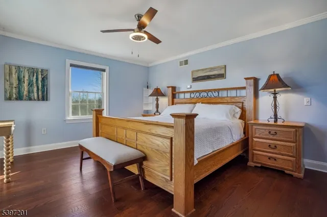 a view of room with furniture and wooden floor