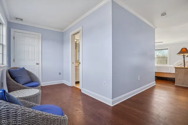 a spacious bathroom with a double vanity sink a mirror and next to a window