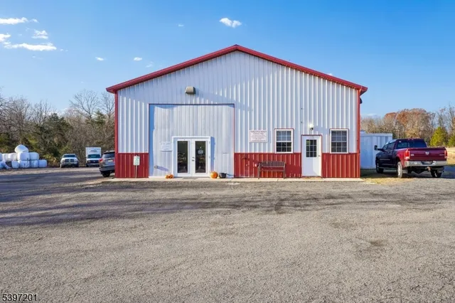 a view of a yard with an house in the background