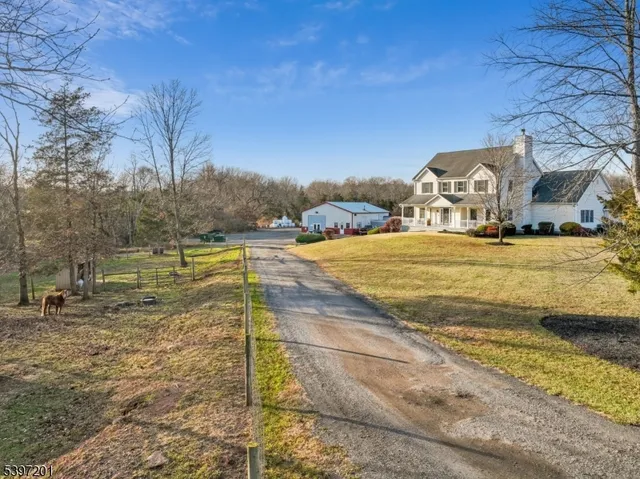 a view of a lake with couches and city view
