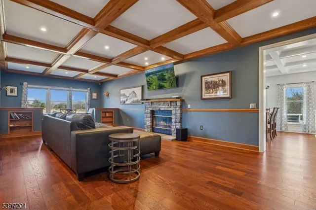 a kitchen with granite countertop a sink and refrigerator