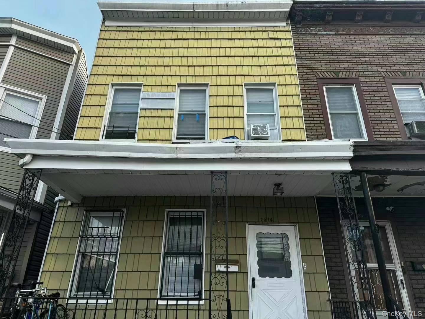 55-14 Van Cleef Street Queens, NY 11368 - Photo 2 of 9 a front view of a multi story building