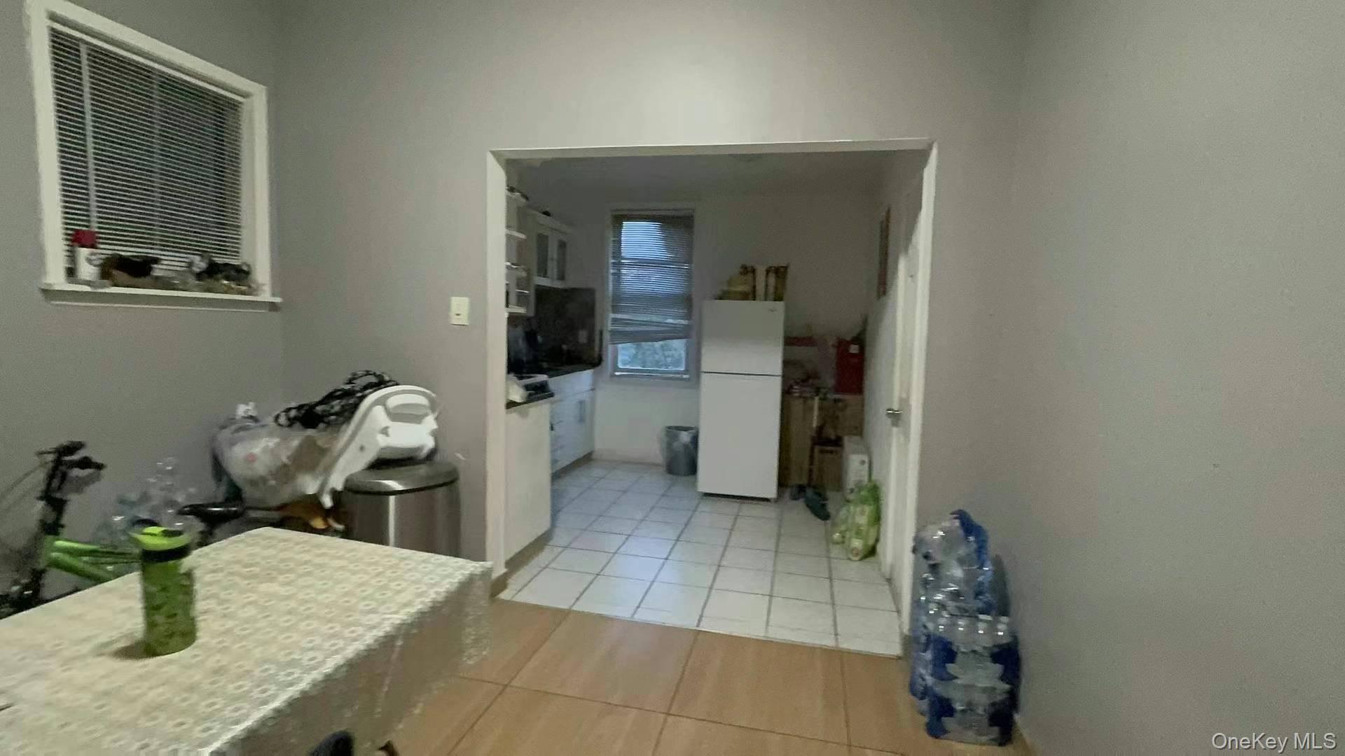 55-14 Van Cleef Street Queens, NY 11368 - Photo 6 of 9 a kitchen with a sink and a stove top oven