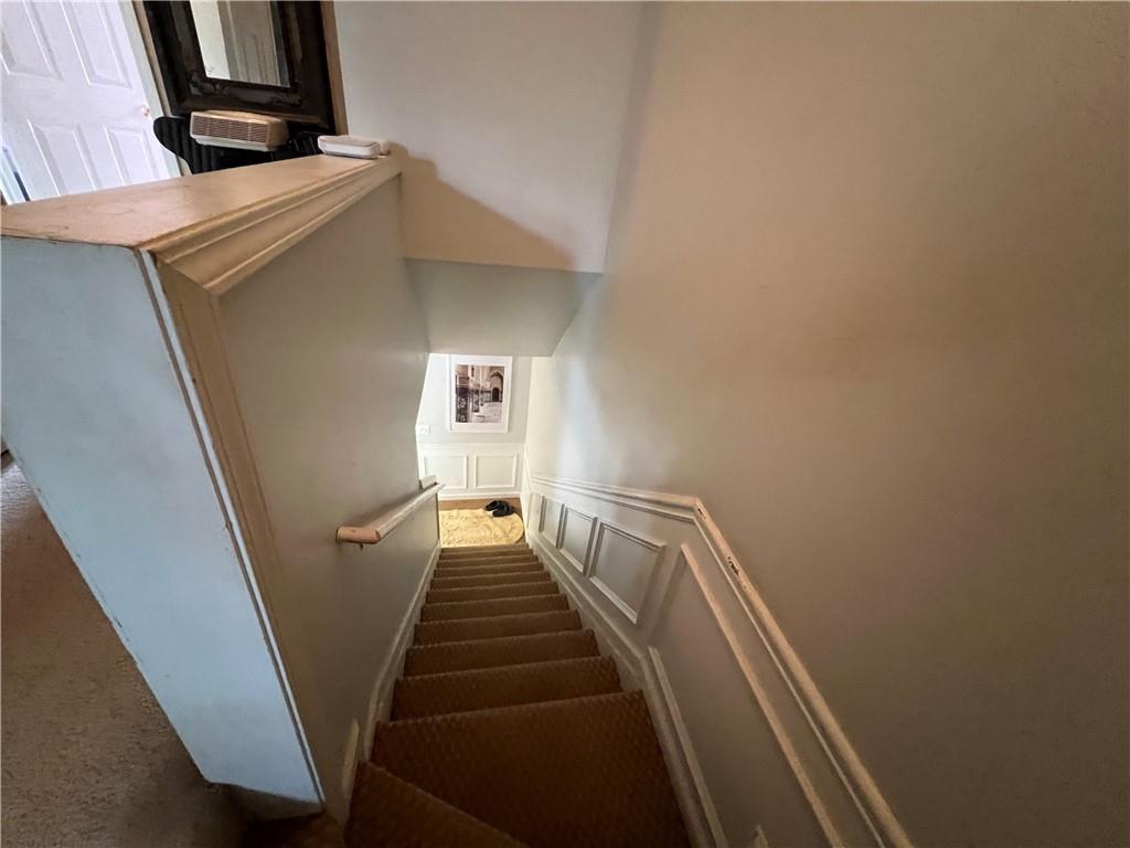 3914 Howell Park Road Duluth, GA 30096 - Photo 20 of 33 a view of entryway with stairs and wooden floor