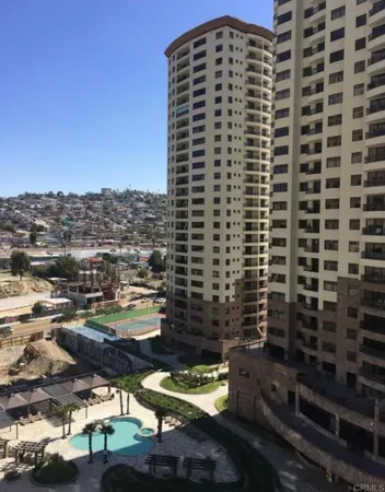 a living room with furniture and floor to ceiling window