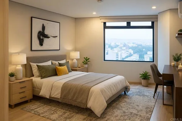 a bedroom with a large bed and a painting on the wall