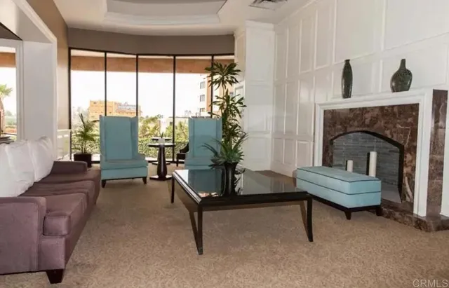 an aerial view of a house with a garden and lake view