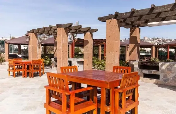 a view of a hallway with paintings on the wall