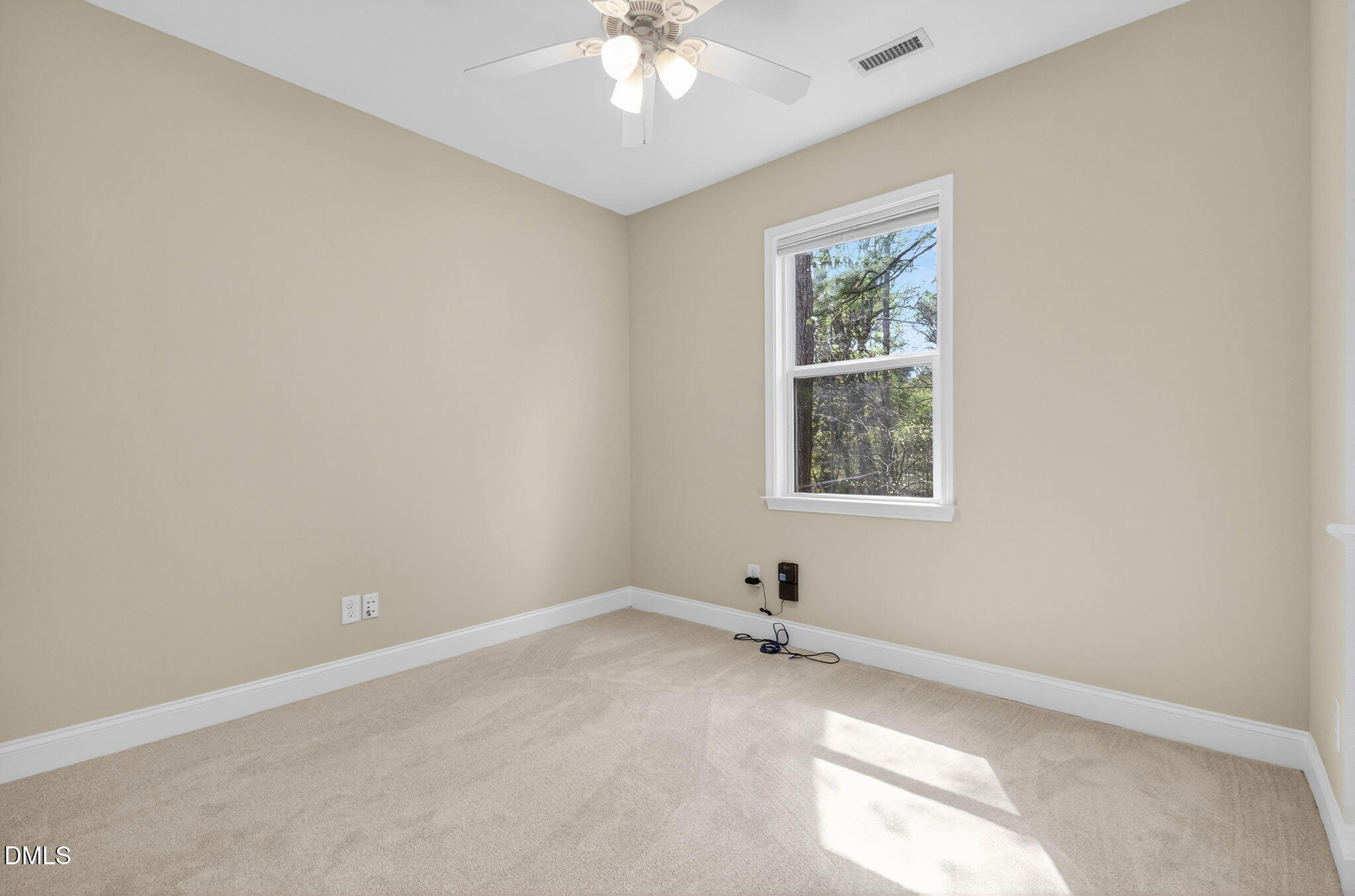 1304 Barnford Mill Road Wake Forest, NC 27587 - Photo 14 of 44 an empty room with a window and a ceiling fan