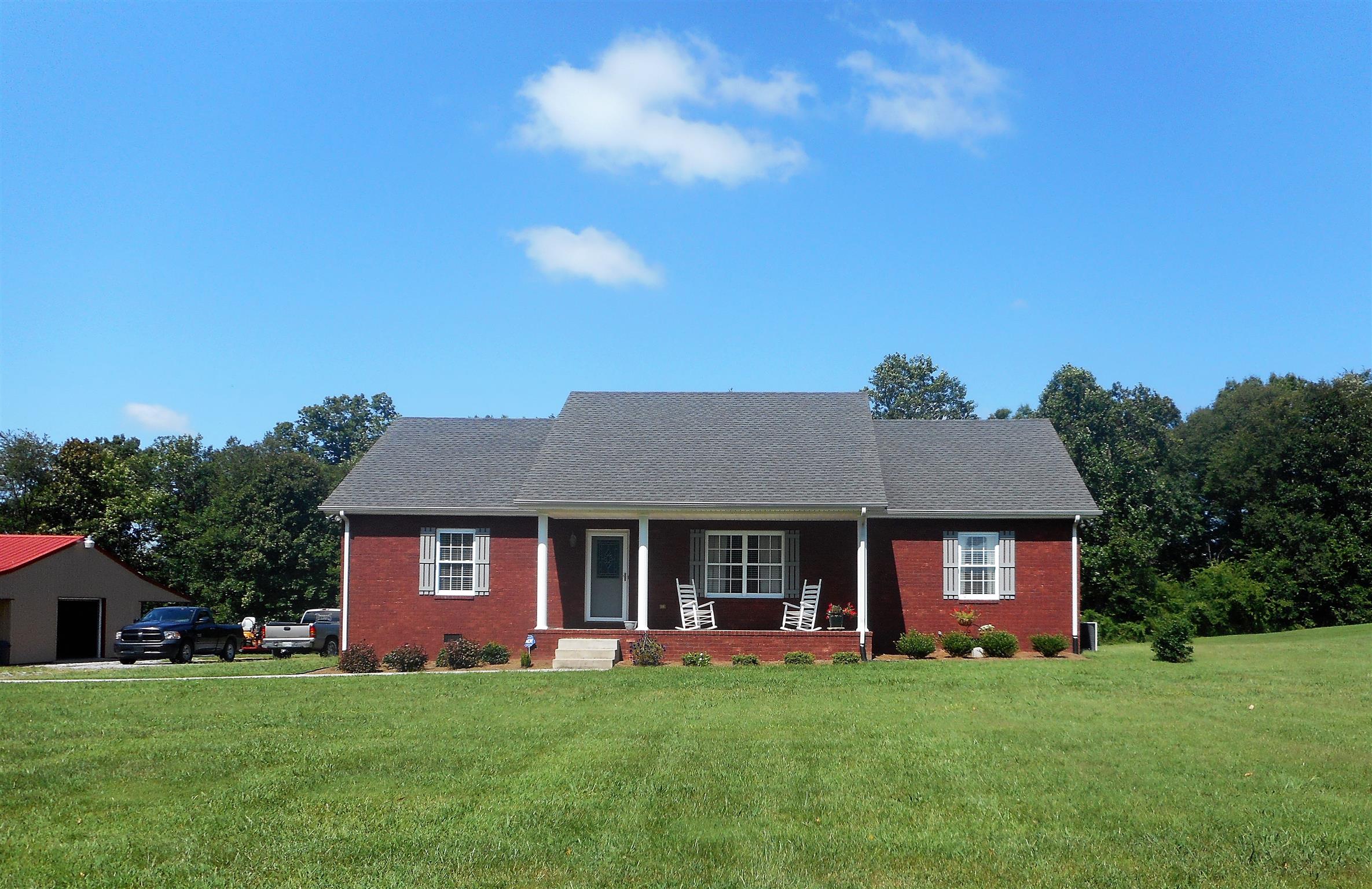 4202 Roy Cole Road Springfield, TN 37172 - Photo 1 of 17 a front view of a house with a garden
