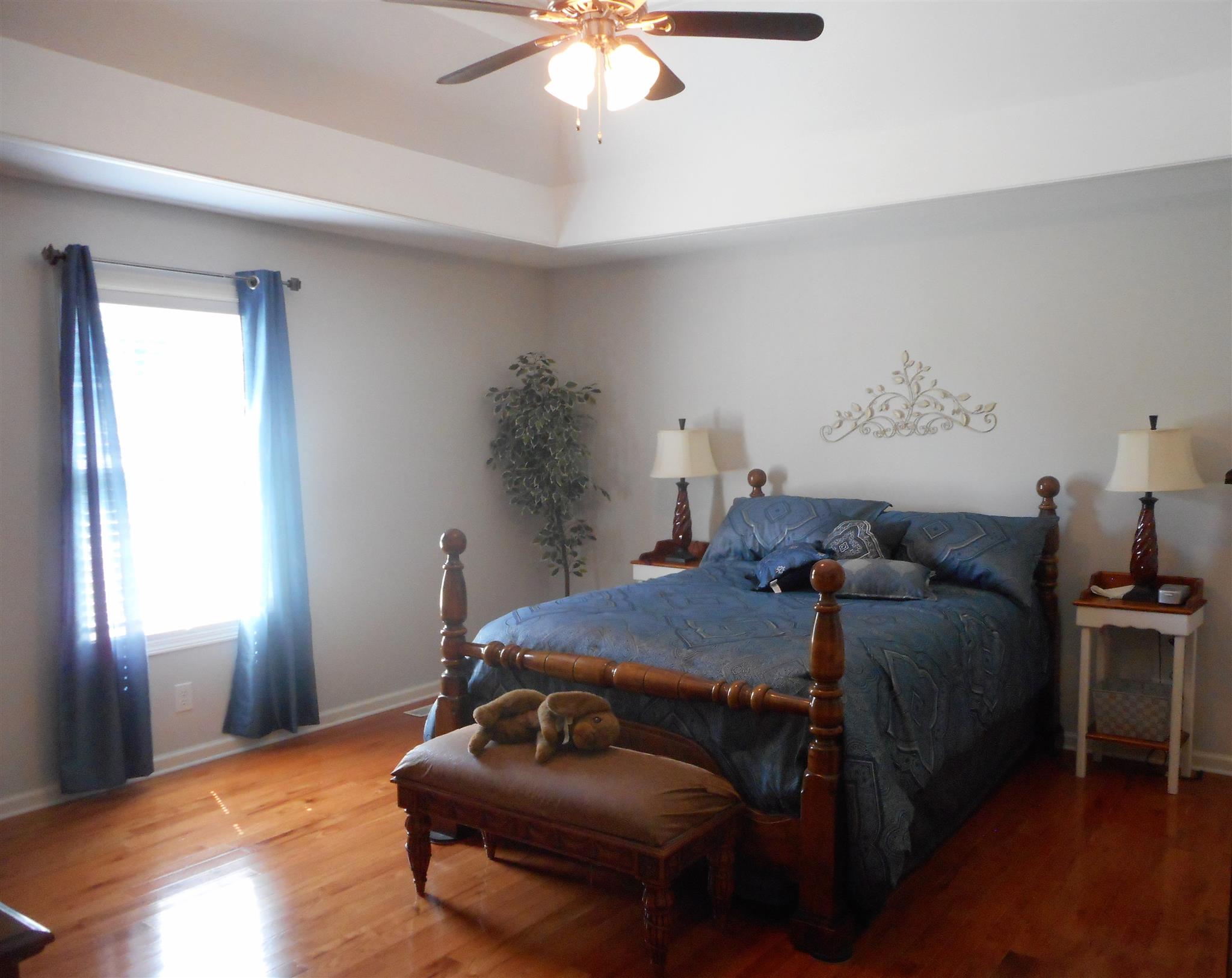 4202 Roy Cole Road Springfield, TN 37172 - Photo 6 of 17 a bedroom with a bed and a chandelier