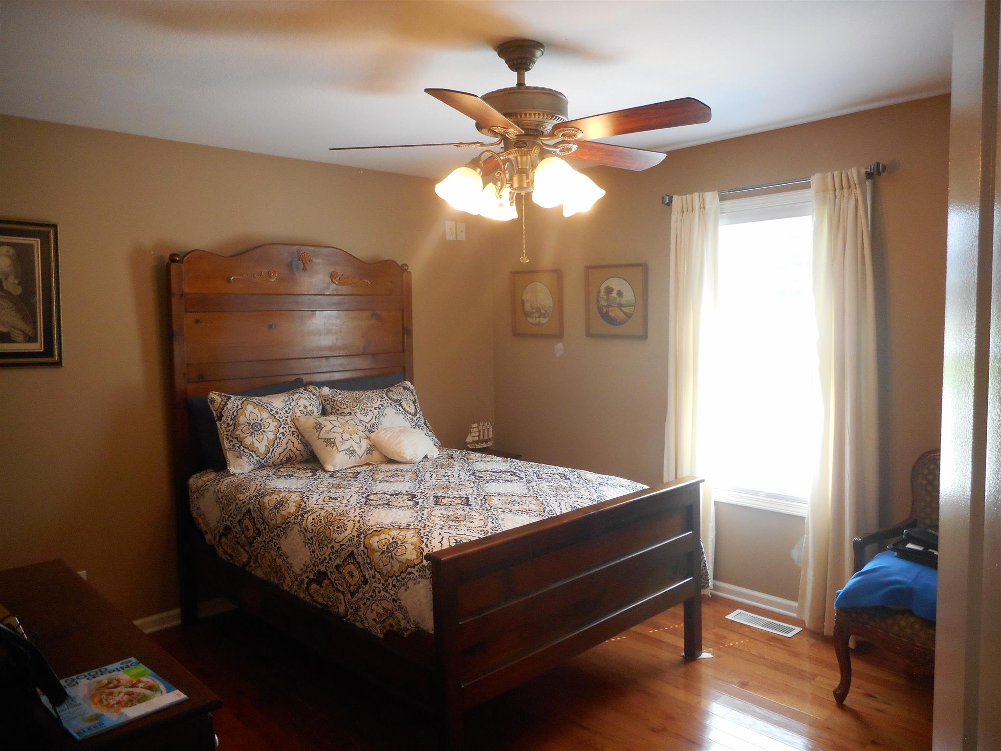 4202 Roy Cole Road Springfield, TN 37172 - Photo 8 of 17 a bed sitting in a bedroom next to a window