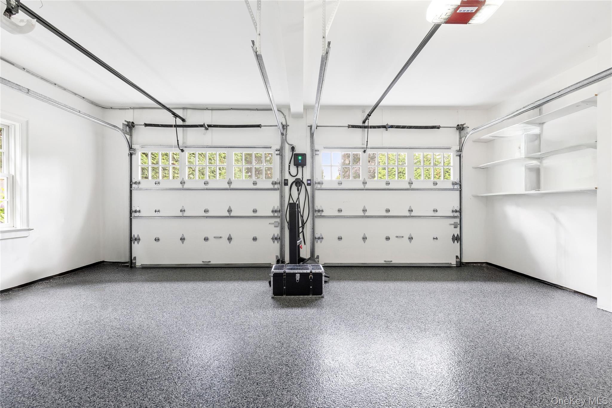 394 Park Avenue Rye, NY 10580 - Photo 28 of 36 Spacious 2 car garage with new 2025 polyaspartic floor coating & Level 2 EV wall charger