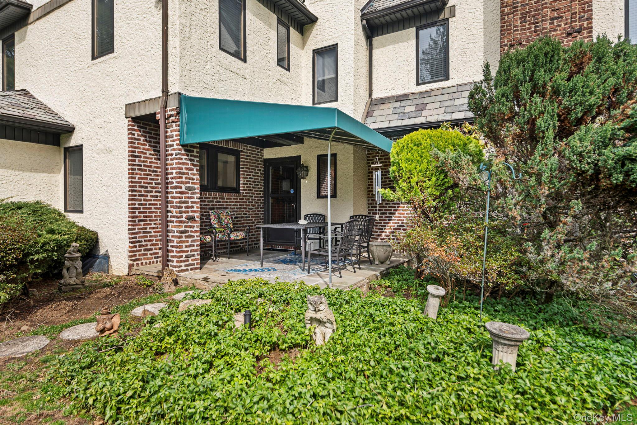 44 Fenimore Road New Rochelle, NY 10804 - Photo 34 of 46 a front view of a house with garden