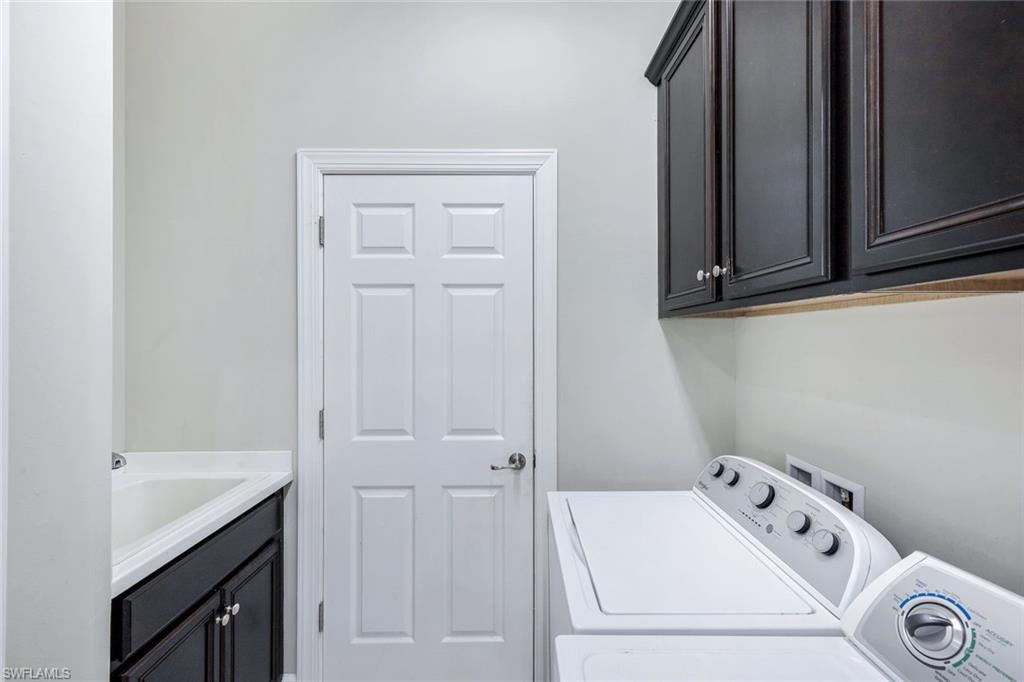 9062 Limestone Lane Naples, FL 34120 - Photo 20 of 48 a utility room with dryer and washer