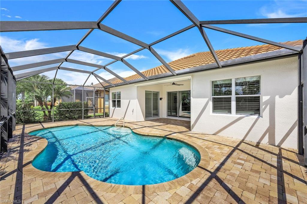 9062 Limestone Lane Naples, FL 34120 - Photo 22 of 48 a view of a house with backyard and sitting area