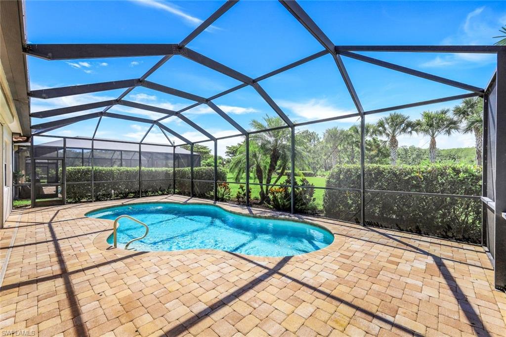9062 Limestone Lane Naples, FL 34120 - Photo 23 of 48 a view of a backyard of a house