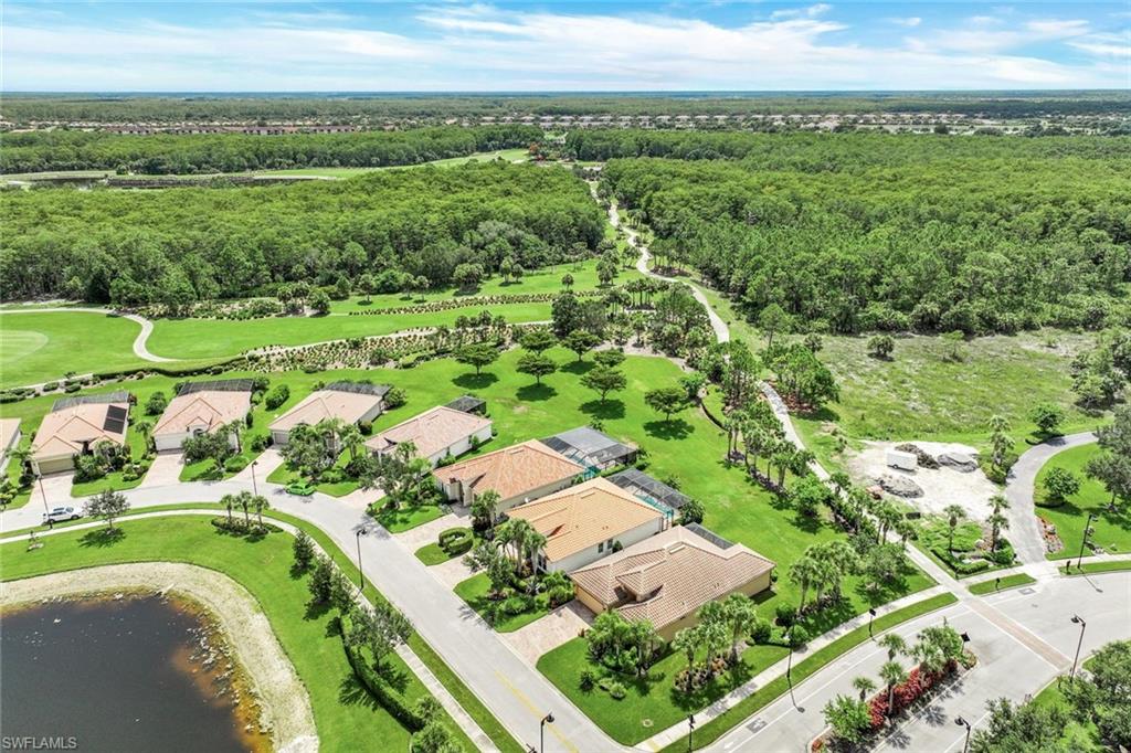 9062 Limestone Lane Naples, FL 34120 - Photo 25 of 48 a view of a city with an ocean
