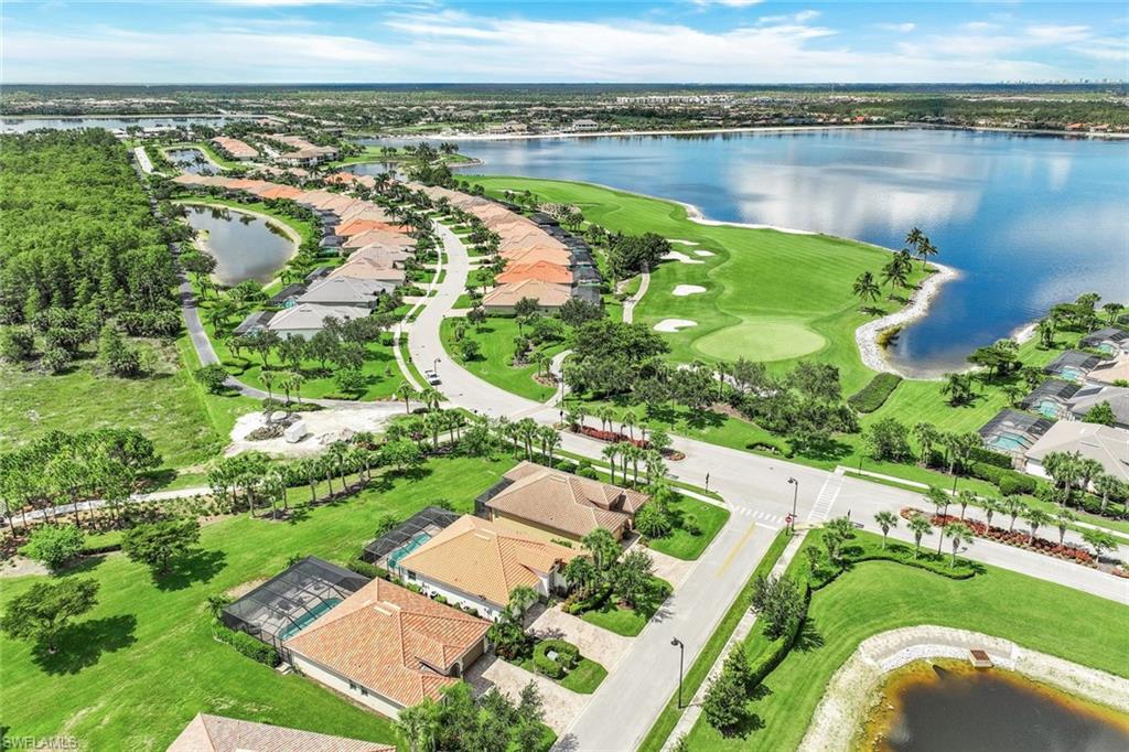 9062 Limestone Lane Naples, FL 34120 - Photo 26 of 48 an aerial view of lake residential house with swimming pool and outdoor space