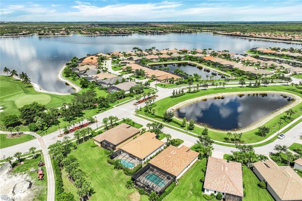 9062 Limestone Lane Naples, FL 34120 - Photo 27 of 48 an aerial view of a house with outdoor space and lake view