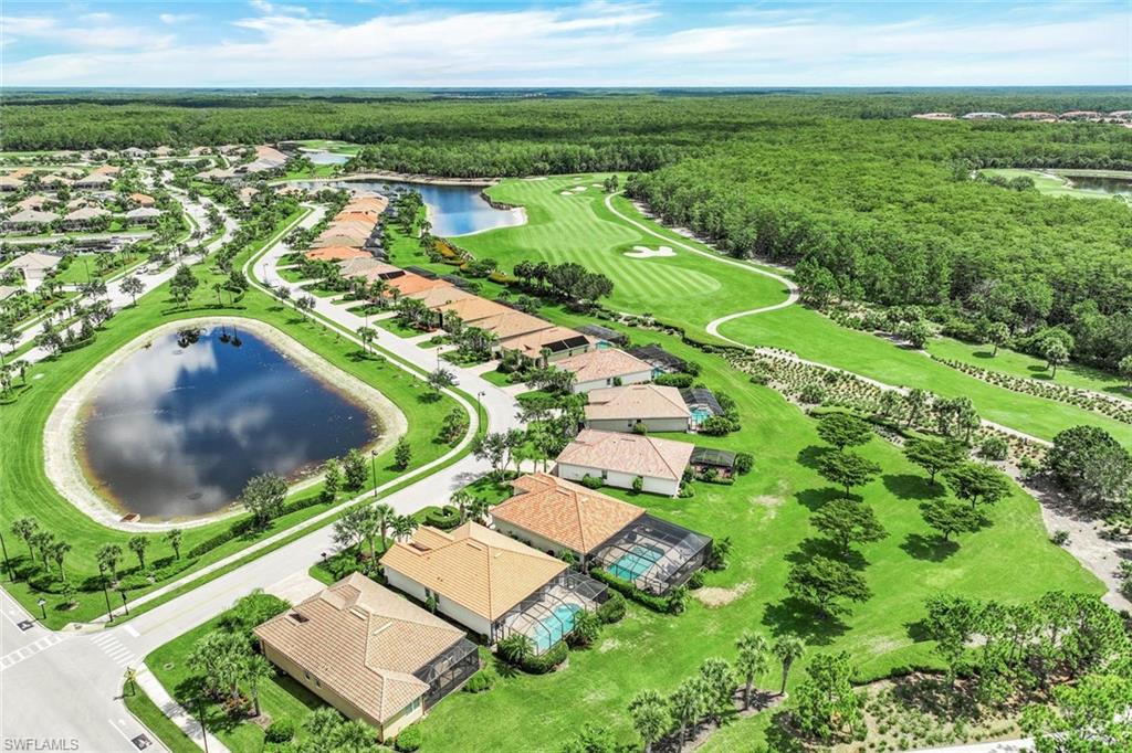 9062 Limestone Lane Naples, FL 34120 - Photo 28 of 48 an aerial view of residential houses with outdoor space and lake view