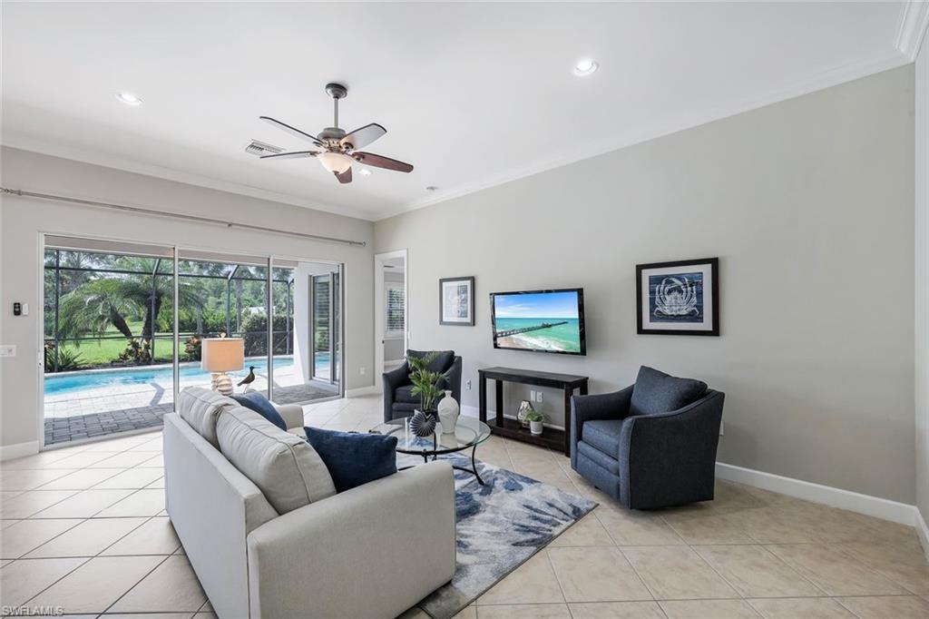 9062 Limestone Lane Naples, FL 34120 - Photo 7 of 48 a living room with furniture and a large window