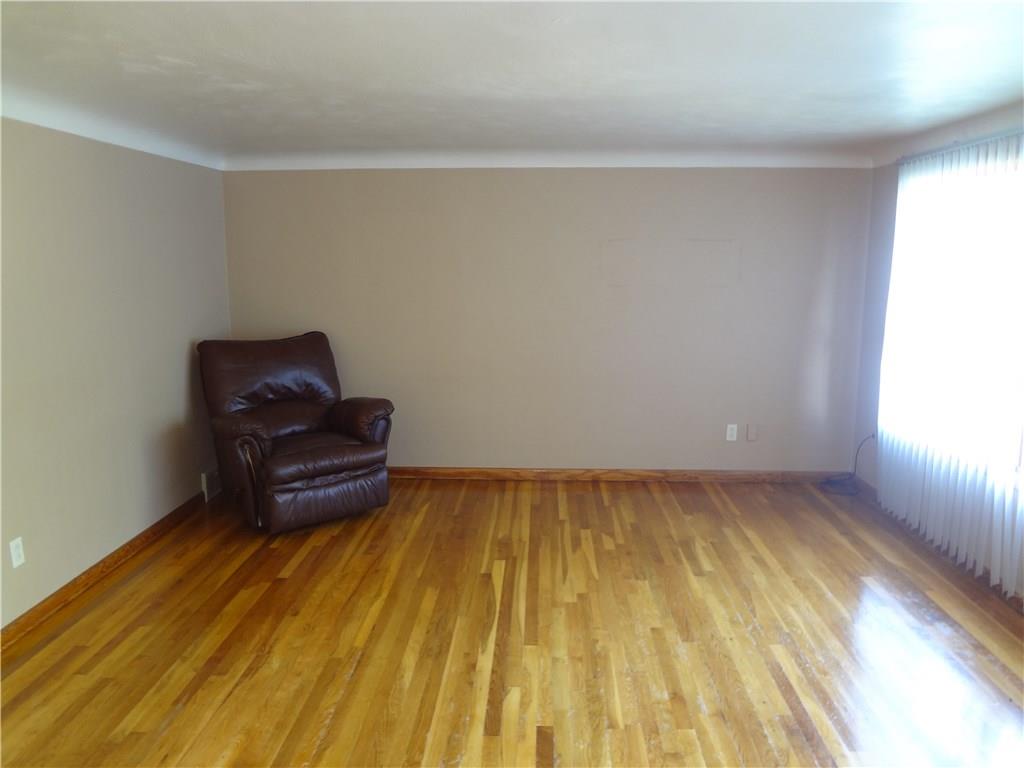303 Madison Heights Road New Stanton, PA 15672 - Photo 11 of 23 Living Room with Hardwood Floors and Huge Picture Window.