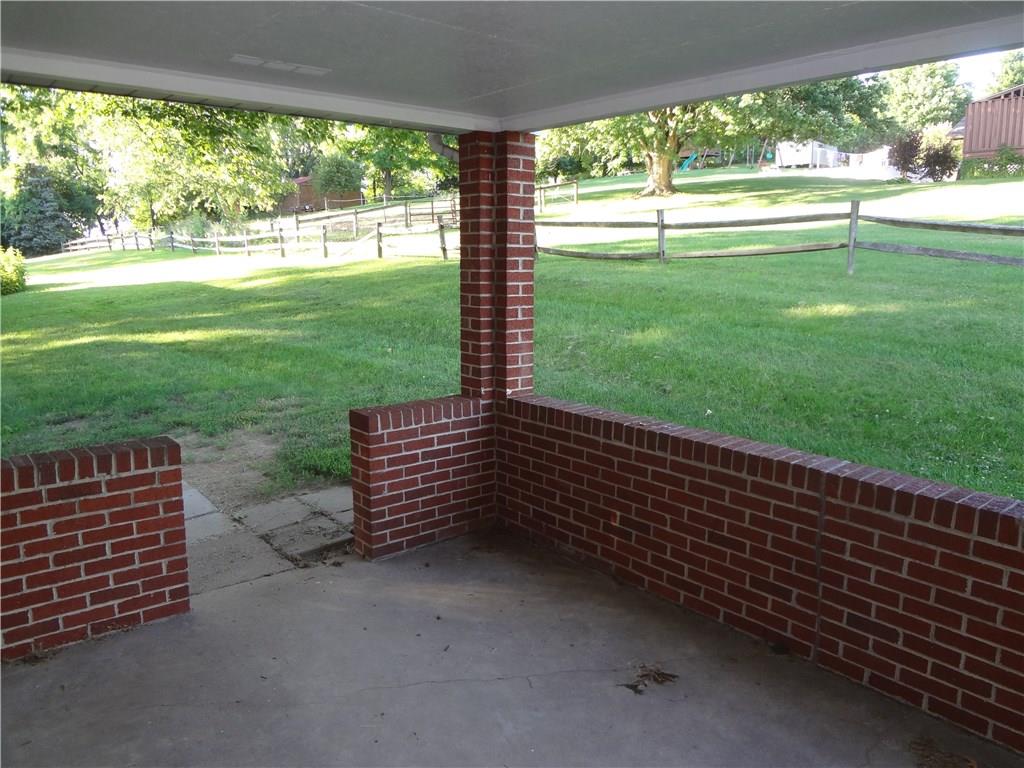 303 Madison Heights Road New Stanton, PA 15672 - Photo 3 of 23 View from outside Kitchen Door onto Covered Patio.