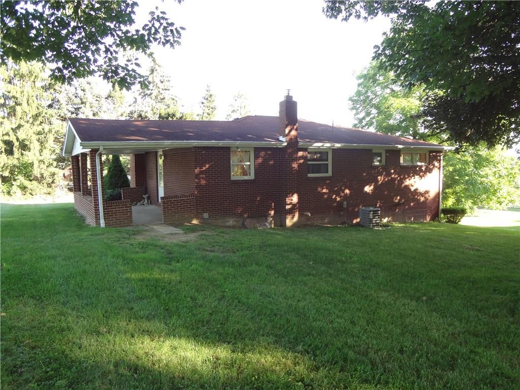 303 Madison Heights Road New Stanton, PA 15672 - Photo 5 of 23 Rear View of Home with Large Side Covered Patio.