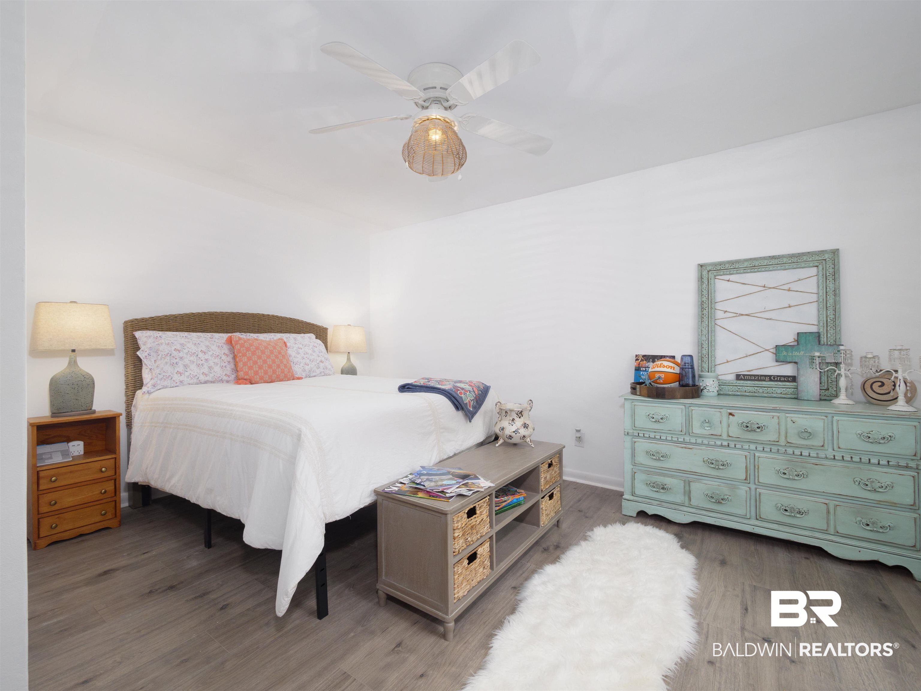 494 Ridgewood Drive Daphne, AL 36526 - Photo 21 of 40 Bedroom with wood-type flooring and ceiling fan