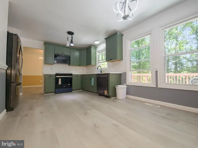 a view of a hallway with a small living room