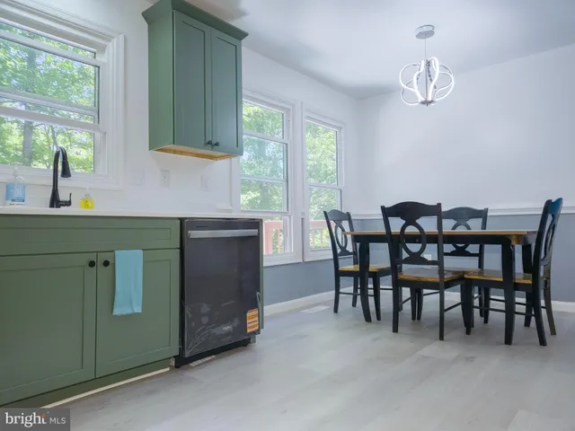 a view of room with a ceiling fan and window