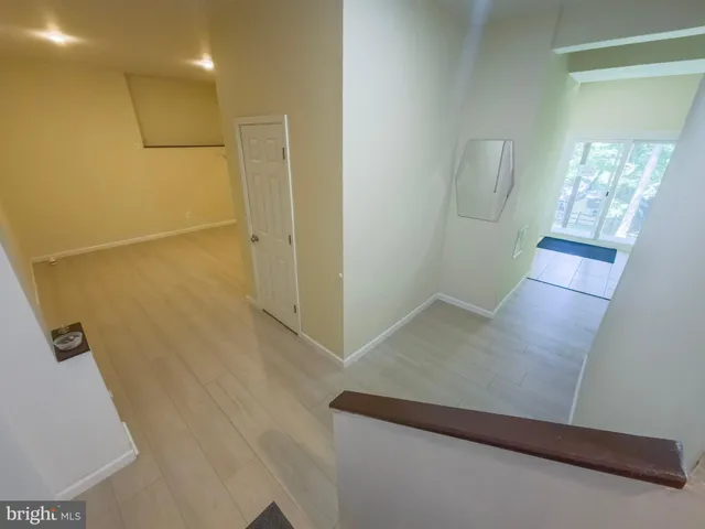 an outdoor space with swimming pool and green space